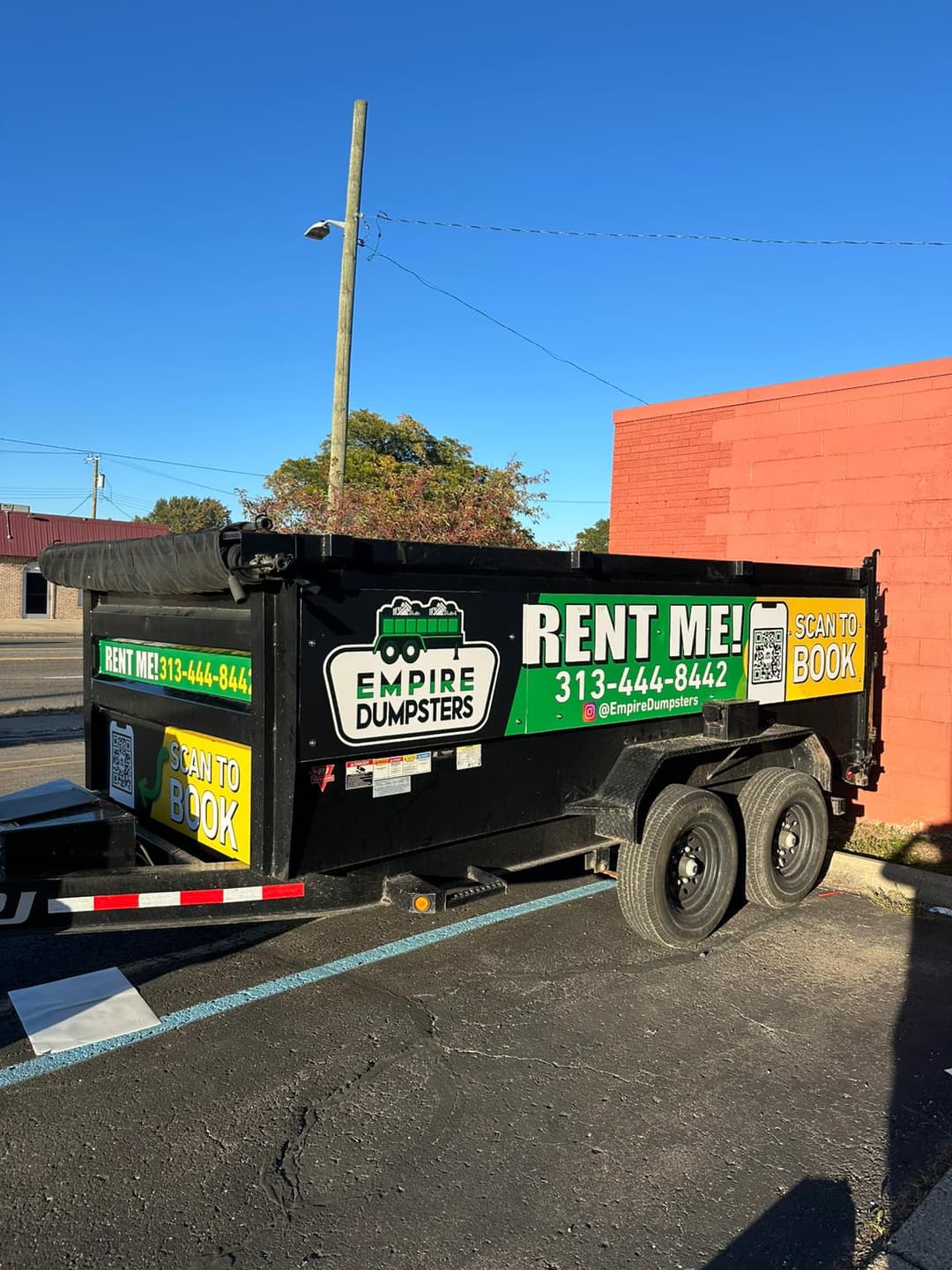Empire Dumpsters roll-off container placed on a driveway for a cleanout